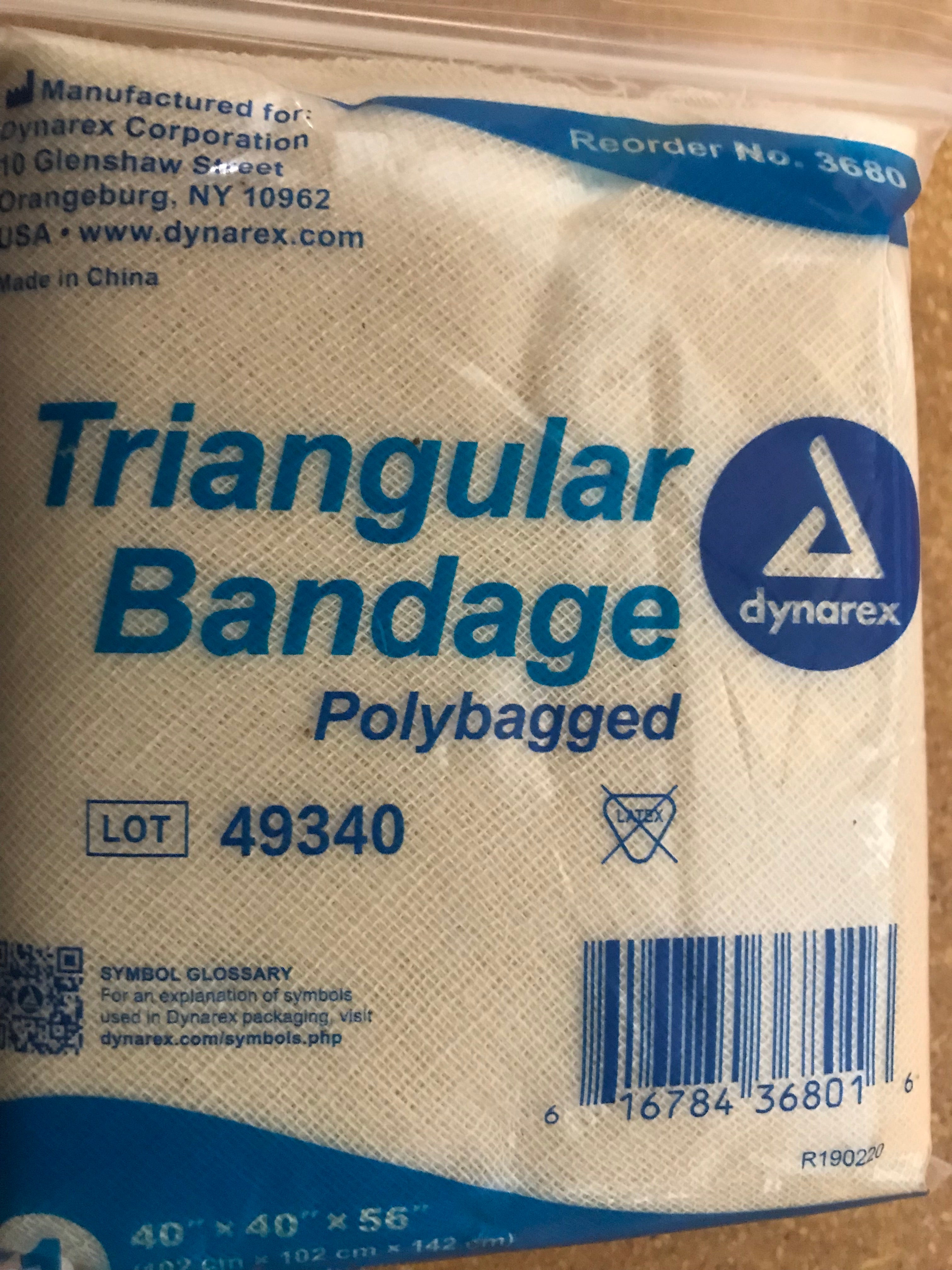 Cravat (Triangle Bandage) - Dynarex brand polybagged triangular muslin bandage in sealed packaging, showing product details and barcode. White bandage material with blue text and company logo.