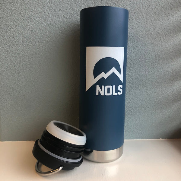 Klean Kanteen TKWide Insulated 20oz Tumbler in navy blue with white NOLS mountain logo, shown with detached leak-proof cap featuring insulated loop design and stainless steel base