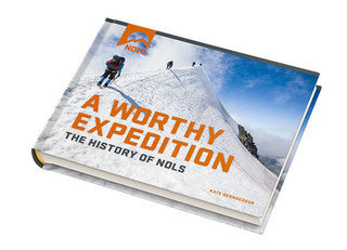 Cover of A Worthy Expedition: The History of NOLS book featuring mountaineers ascending a snowy slope against a vivid blue sky. The book's title appears in bold orange letters across a white hardcover design.